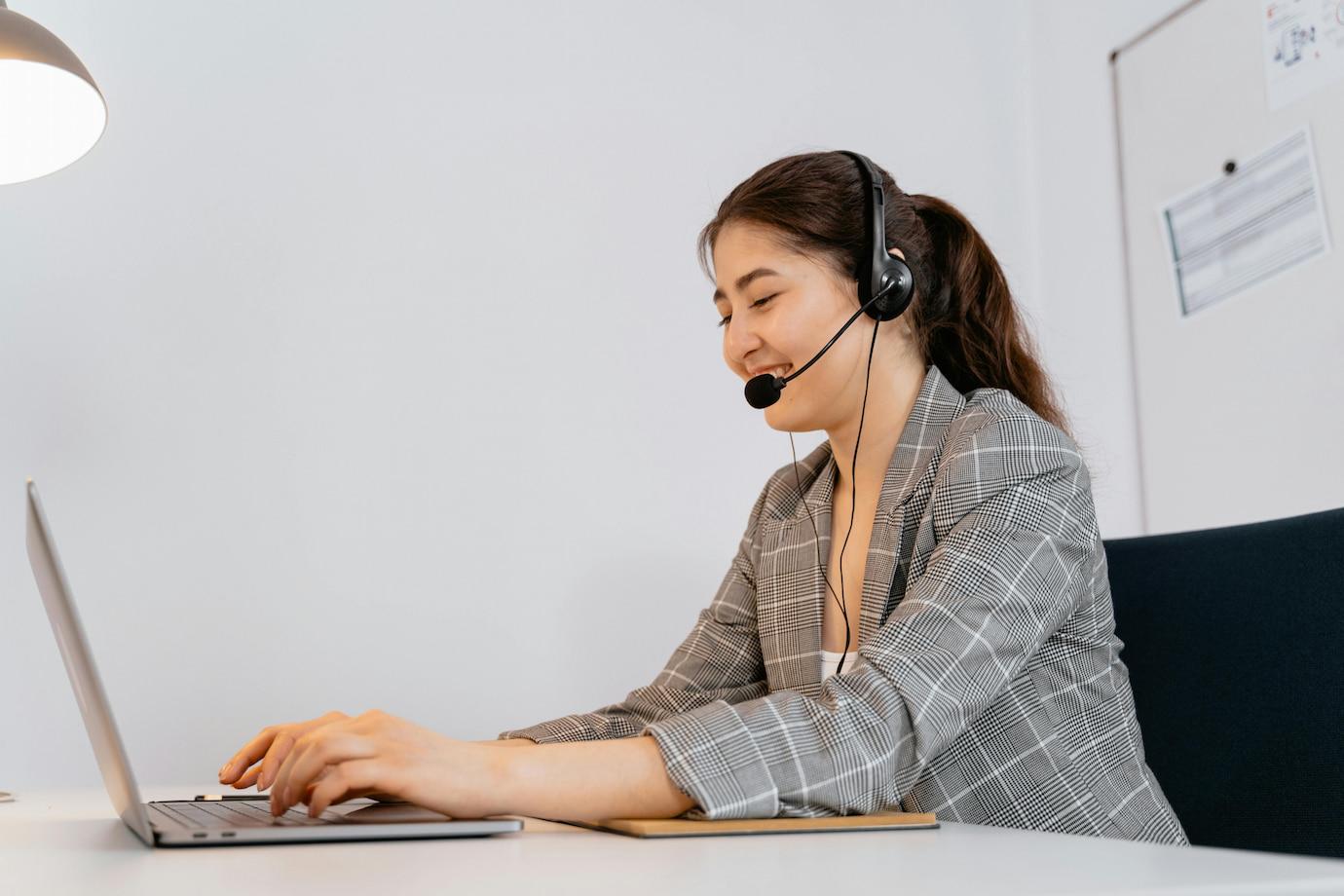 Customer service agent is calling on phone through a software for lead management